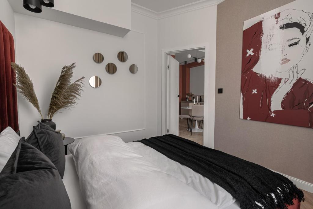Posteľ alebo postele v izbe v ubytovaní APARTIO ROOMS Katowice