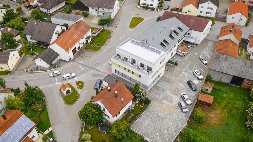 an overhead view of a city with a white building at Hotel Fränkischer Hof in Ingolstadt