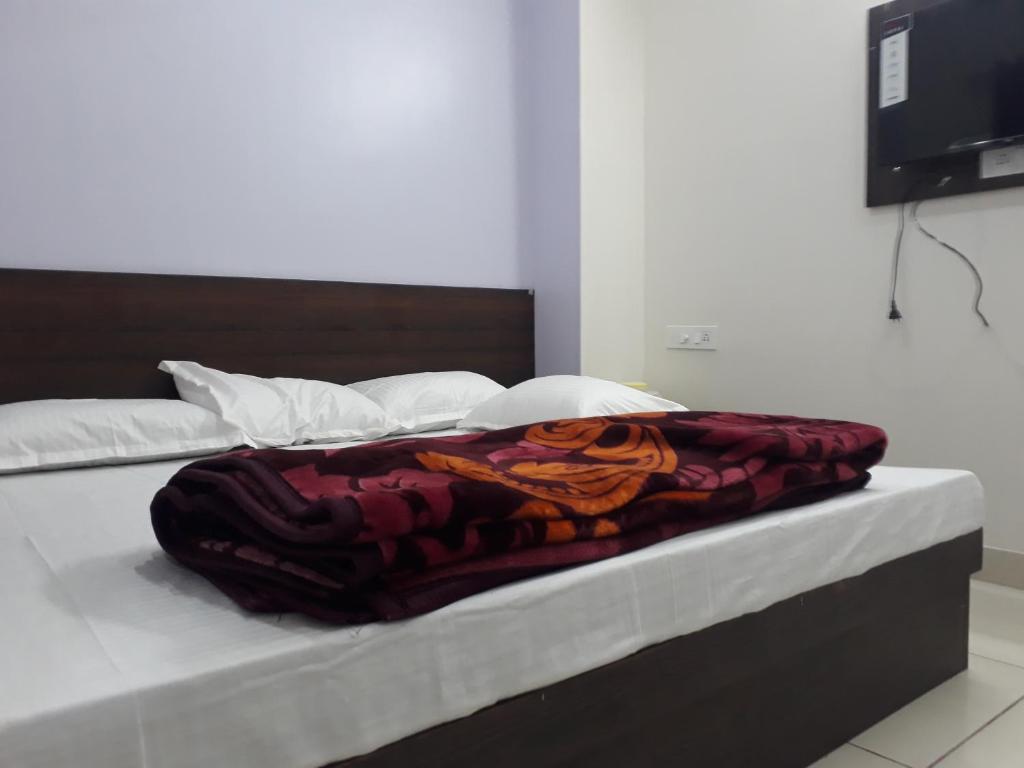 Postel nebo postele na pokoji v ubytování Hotel Chouhan Paradise