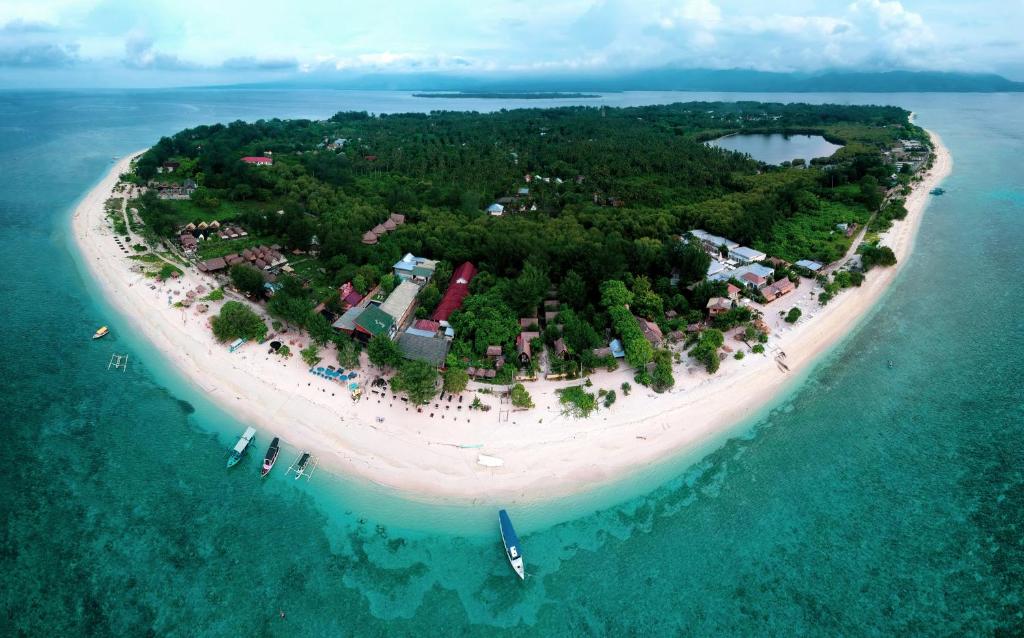 an island in the middle of the ocean at Divine Divers Gili Meno in Gili Meno