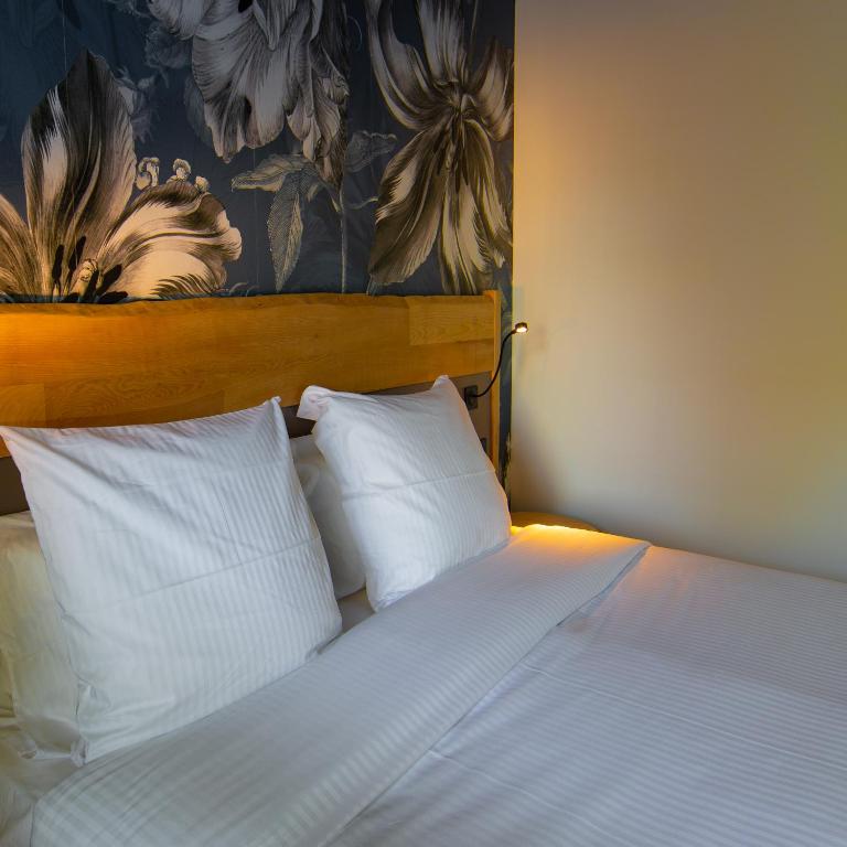Postel nebo postele na pokoji v ubytování Berti Hotel - Mulhouse Centre Gare