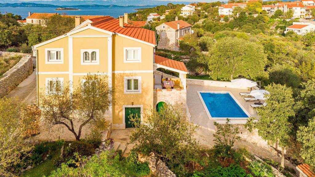 an aerial view of a house with a swimming pool at Villa Sali ZadarVillas in Sali