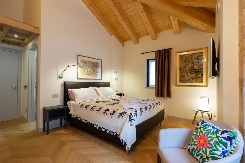 Postel nebo postele na pokoji v ubytování d'ARTEmisia Chambres d'hôtes