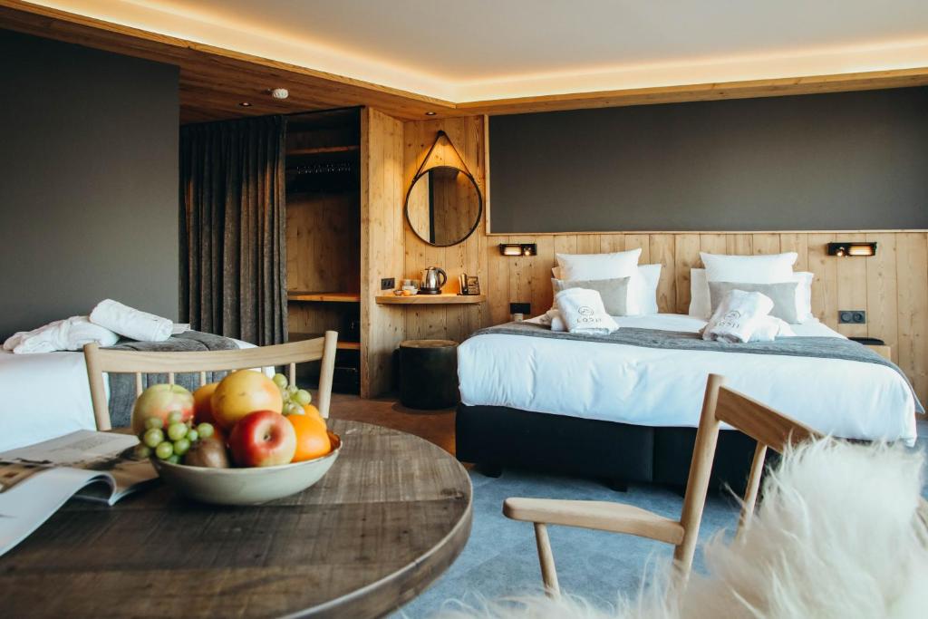Postel nebo postele na pokoji v ubytování Lodji Hotel & spa