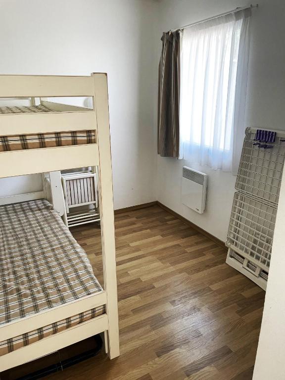 Postel nebo postele na pokoji v ubytování Olydea Oleron les Sables Vignier