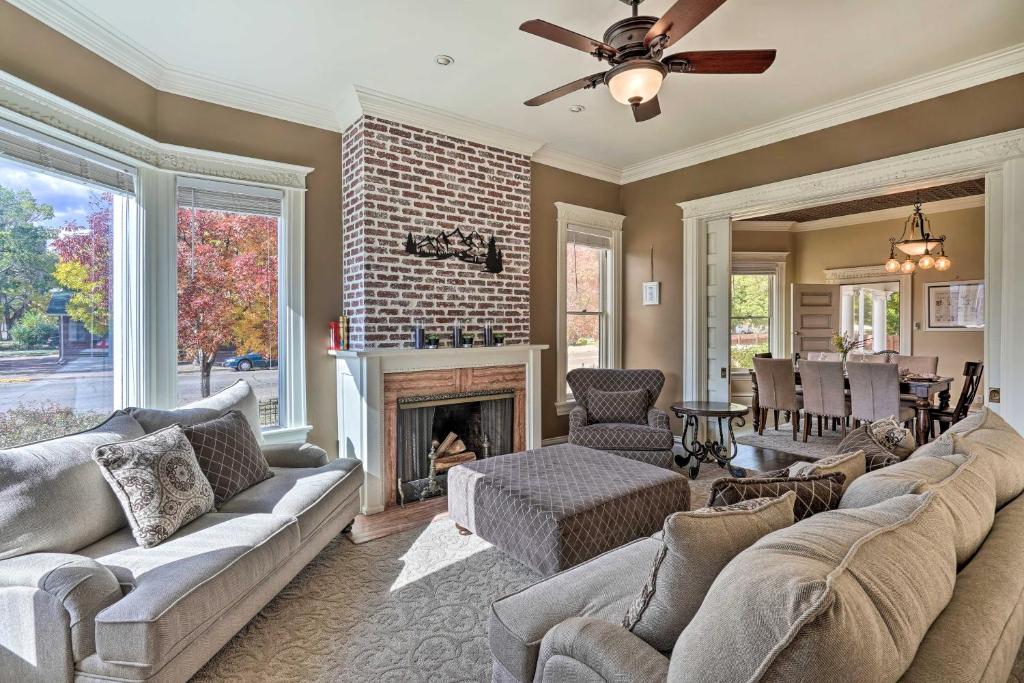 a living room with a couch and a fireplace at Classic Cañon City Getaway - 13 Mi to Royal Gorge! in Canon City