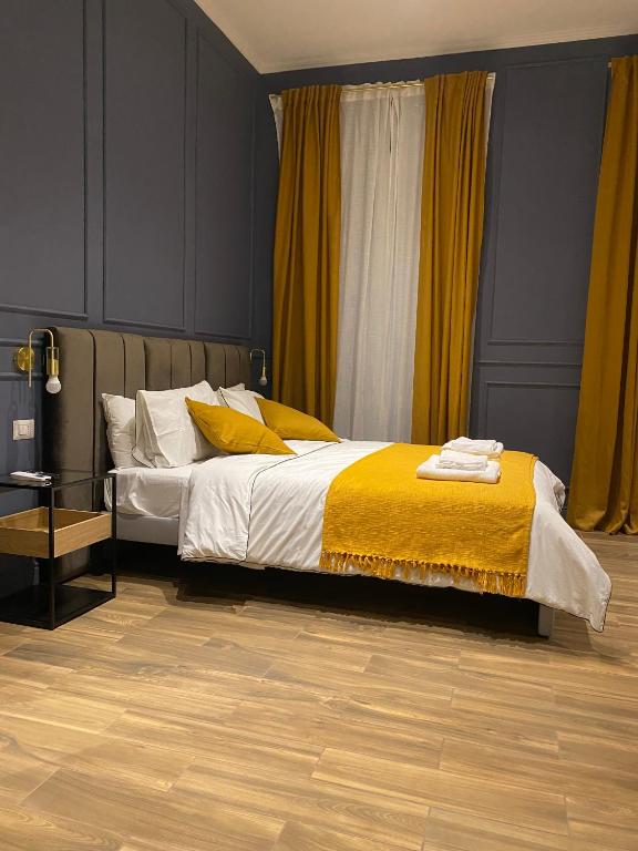 A bed or beds in a room at Allegra Suites