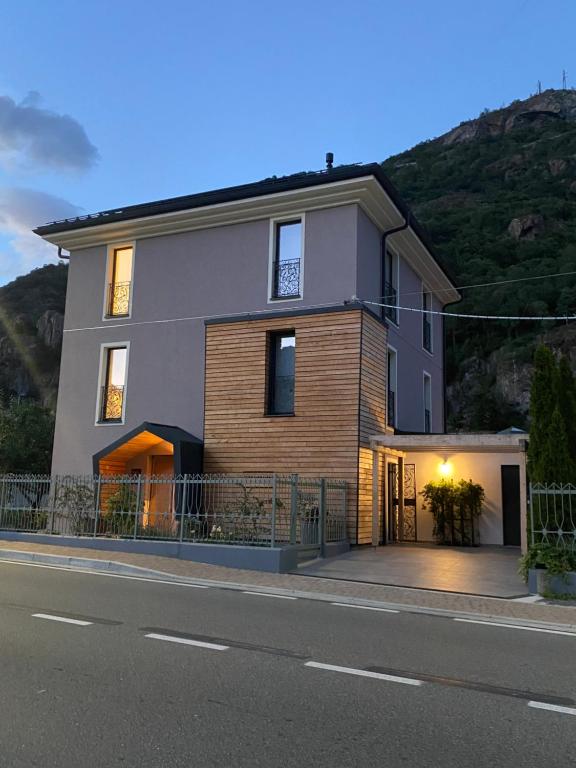 a large house on the side of a street at d'ARTEmisia Chambres d'hôtes in Pont-Saint-Martin