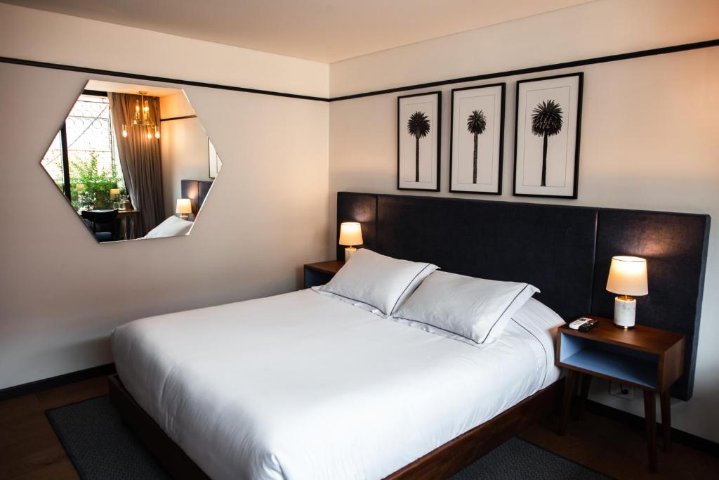 Postel nebo postele na pokoji v ubytování HAB Hotel Bogotá