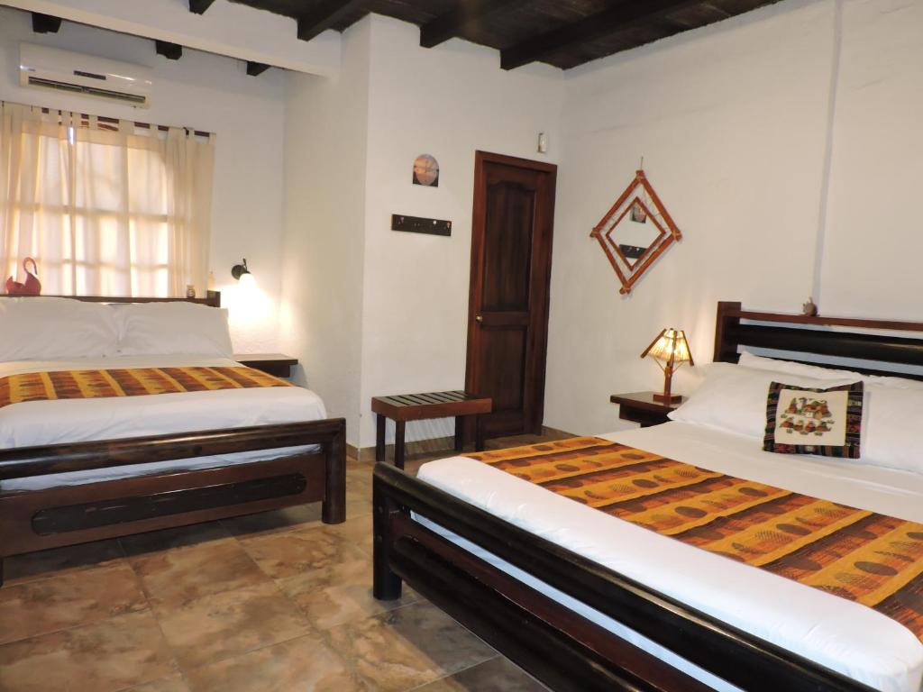 Postel nebo postele na pokoji v ubytování Hotel Puerto Gaviota