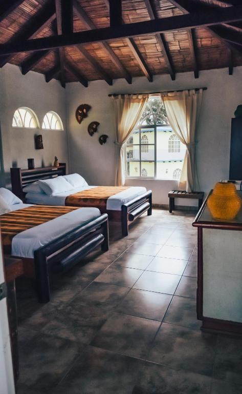 Postel nebo postele na pokoji v ubytování Hotel Puerto Gaviota