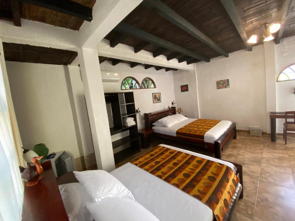 Postel nebo postele na pokoji v ubytování Hotel Puerto Gaviota