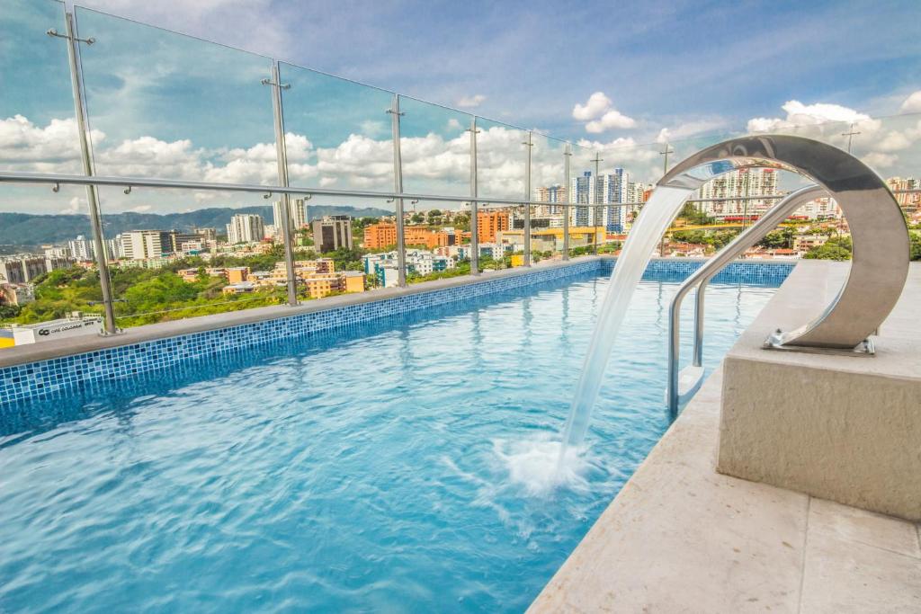 a swimming pool with a view of a city at Sonesta Hotel Bucaramanga in Bucaramanga