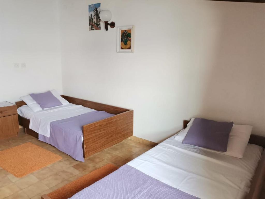 Postel nebo postele na pokoji v ubytování Apartment Margarita