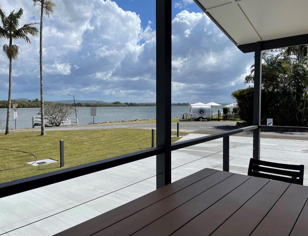 a view of the water from the porch of a house at Fishing Haven Holiday Park in Palmers Island