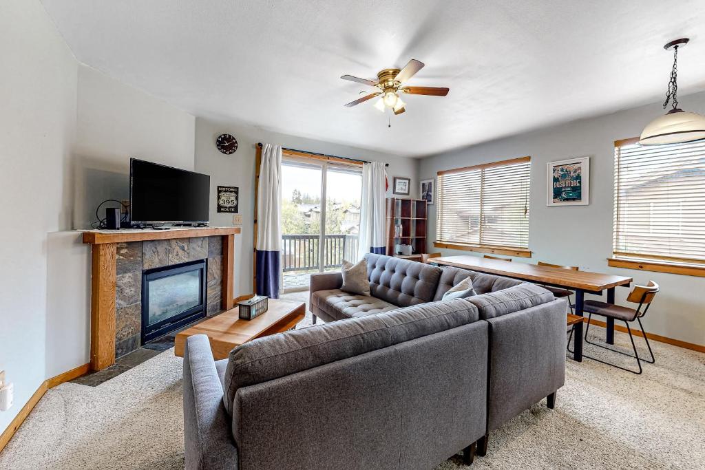 a living room with a couch and a fireplace at Truckee Living in Truckee