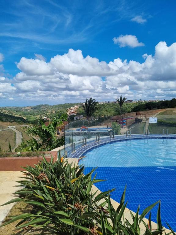 a large swimming pool with a view of the hills at Apartamento em Bananeiras in Bananeiras