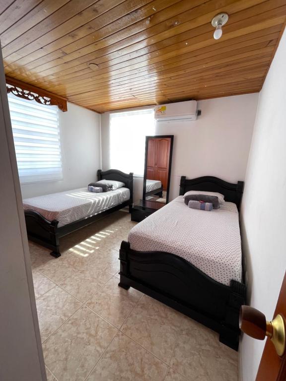 Postel nebo postele na pokoji v ubytování Casa Blanca Increíble Casa Completa Valledupar