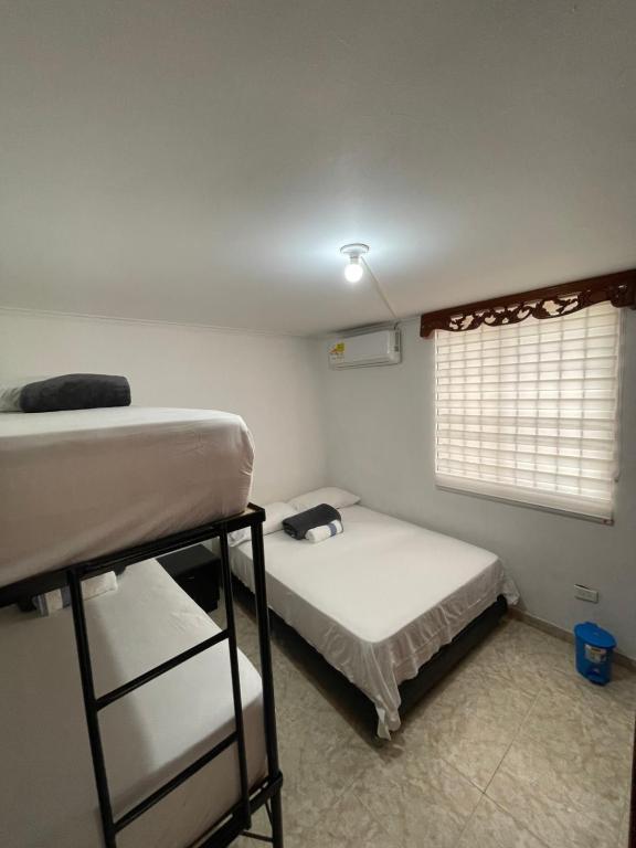 Postel nebo postele na pokoji v ubytování Casa Blanca Increíble Casa Completa Valledupar