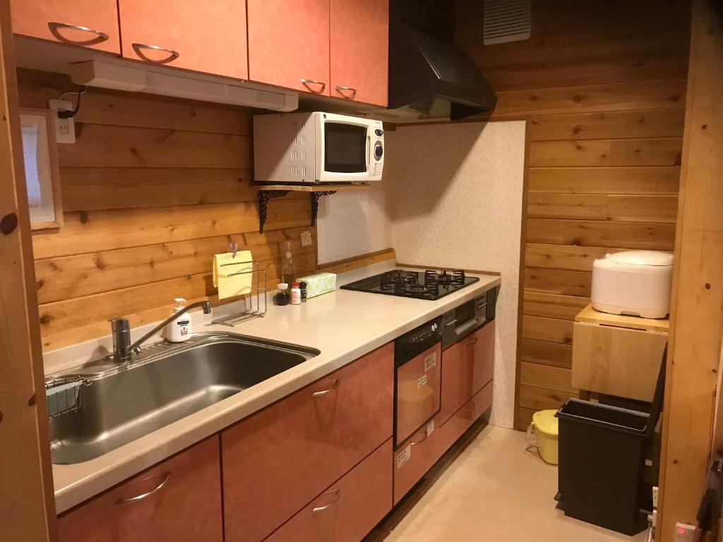 Kuchyň nebo kuchyňský kout v ubytování Madarao Vacances Village