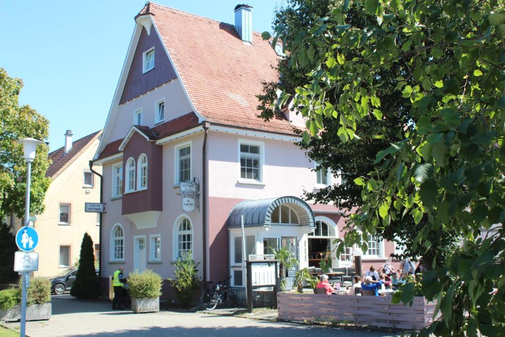 
a house with a large window and a large clock on the front porch at Eichamt in Sigmaringen
