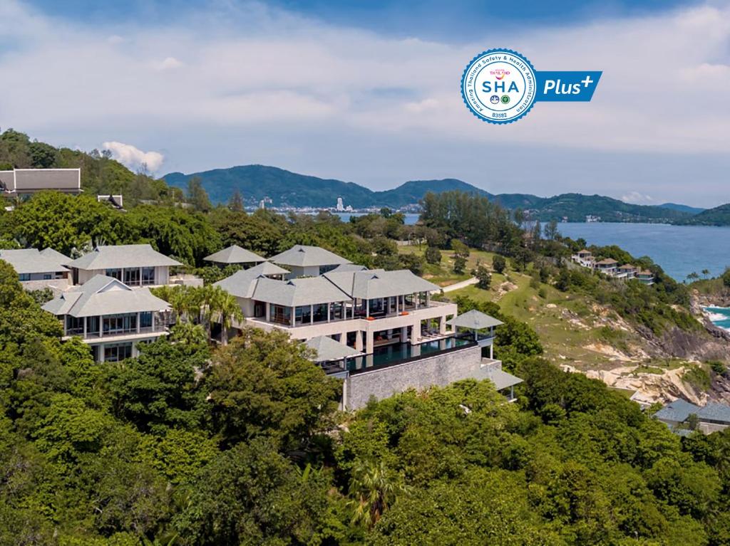 an aerial view of a large house in the trees at Baan Paa Talee Estate - SHA Extra Plus in Kamala Beach