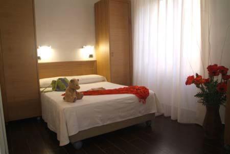 Letto o letti in una camera di Villa Nettuno