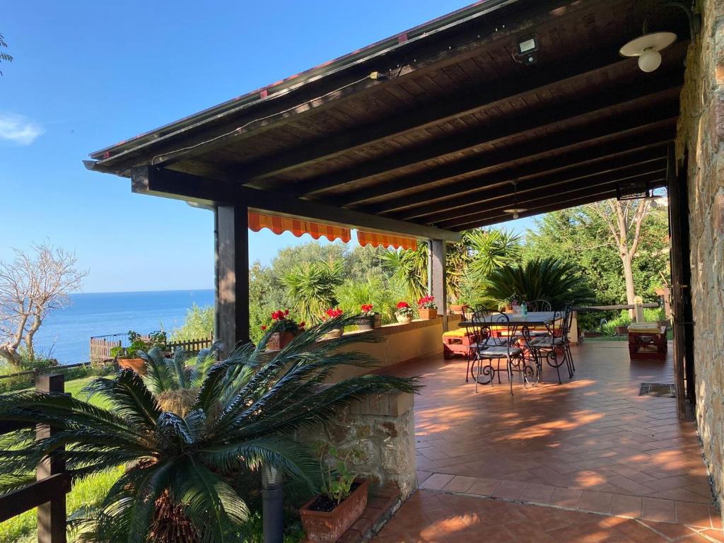 a patio with a view of the ocean at Casa Trachini in Palmi