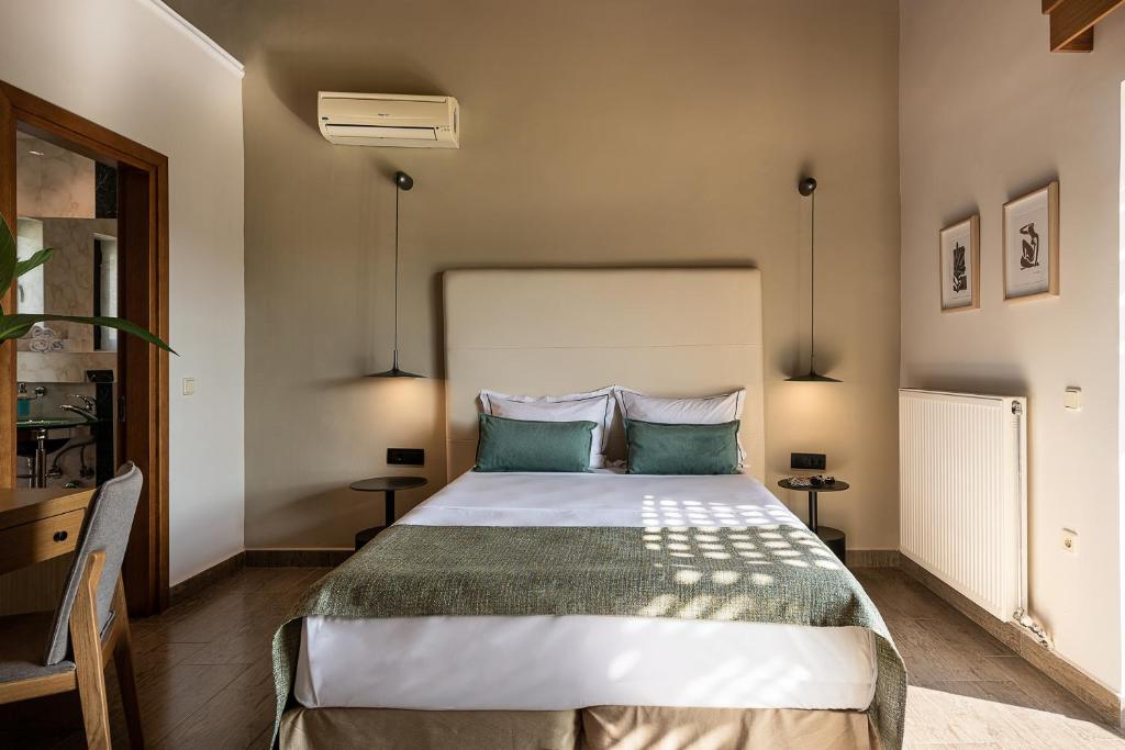 Postel nebo postele na pokoji v ubytování Caldera Platanias Villas