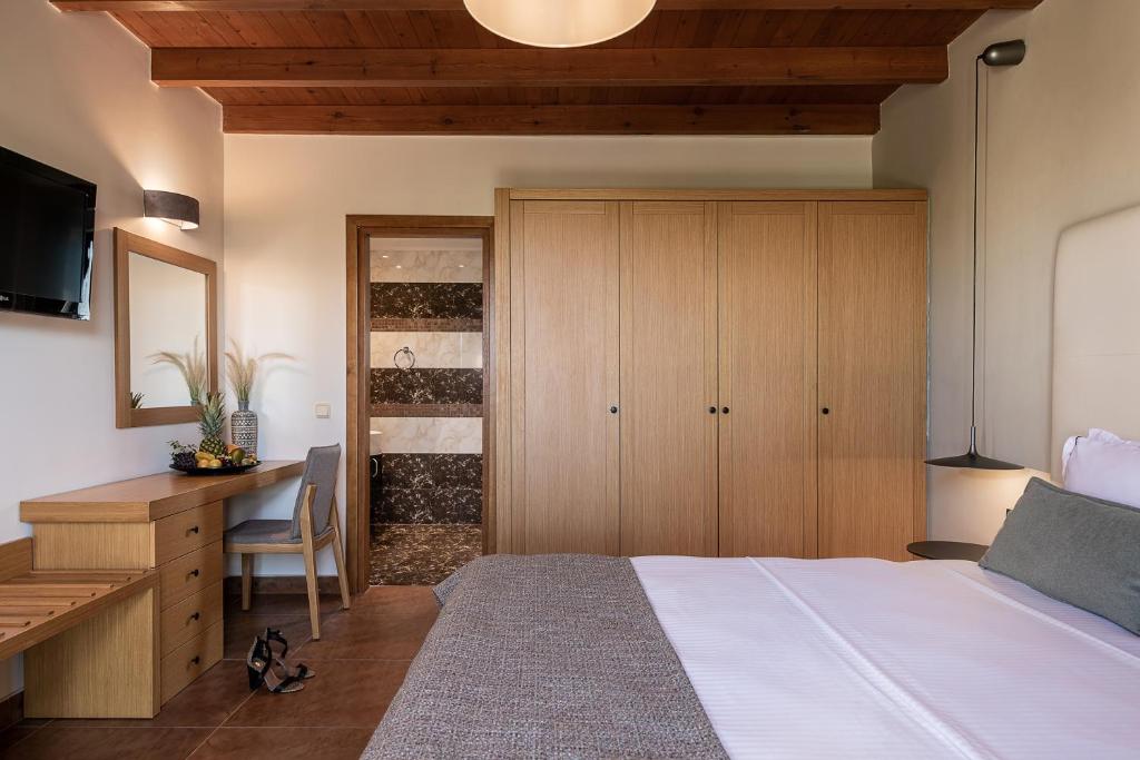 Postel nebo postele na pokoji v ubytování Caldera Platanias Villas