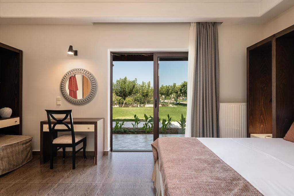 Postel nebo postele na pokoji v ubytování Caldera Platanias Villas