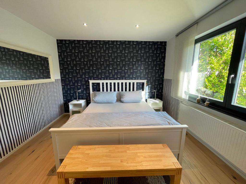 Postel nebo postele na pokoji v ubytování Sailhouse Edersee