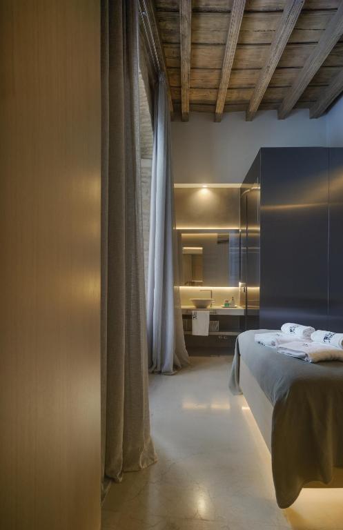 Posteľ alebo postele v izbe v ubytovaní Apartamentos Los Patios del Pañuelo