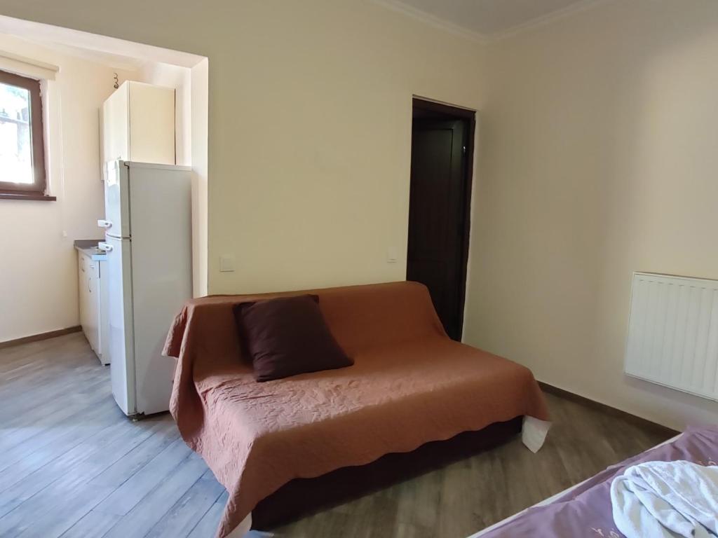 Postel nebo postele na pokoji v ubytování Guest House Gelit