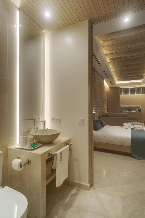 Posteľ alebo postele v izbe v ubytovaní Apartamentos Los Patios del Pañuelo