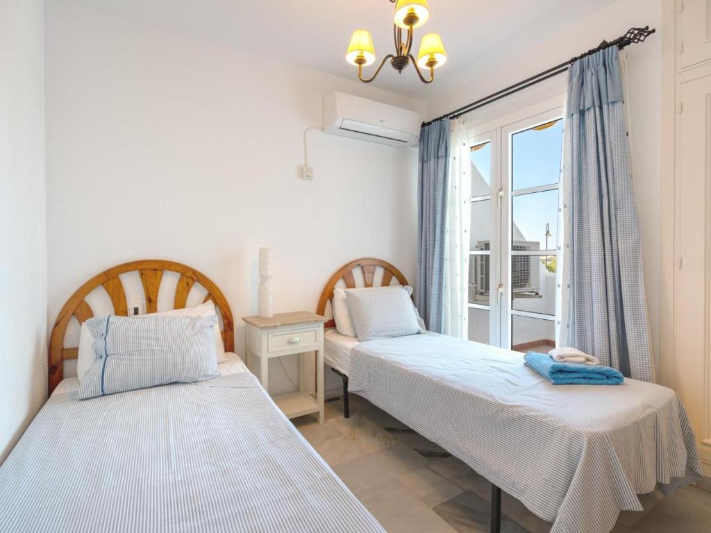Posteľ alebo postele v izbe v ubytovaní 2 Mijas Playa Club in La Cala de Mijas