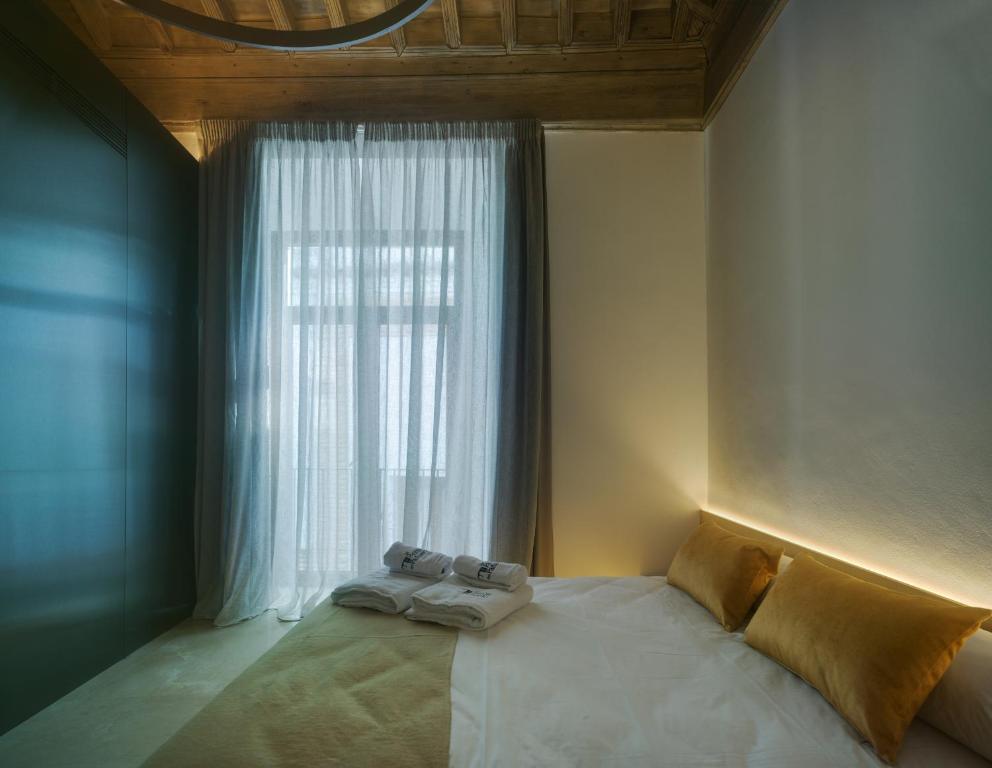 Posteľ alebo postele v izbe v ubytovaní Apartamentos Los Patios del Pañuelo