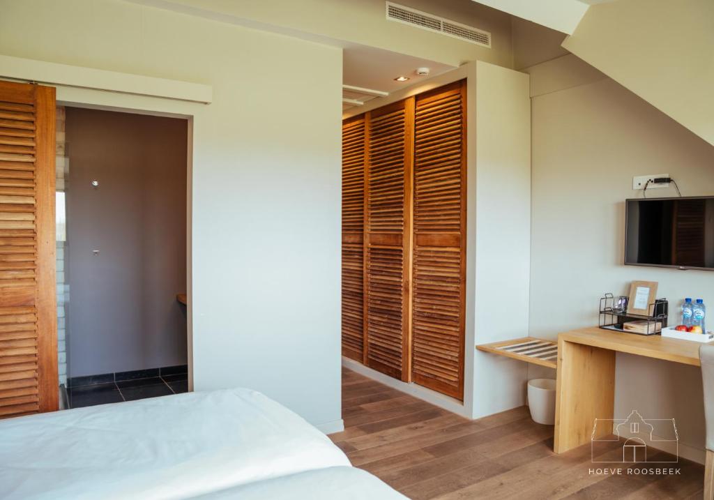 Postel nebo postele na pokoji v ubytování Hoeve Roosbeek