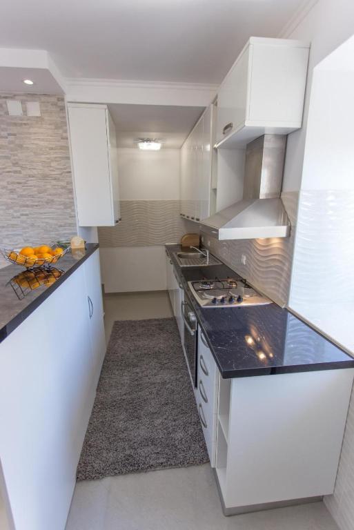 Kuchyňa alebo kuchynka v ubytovaní Apartment Mojaš