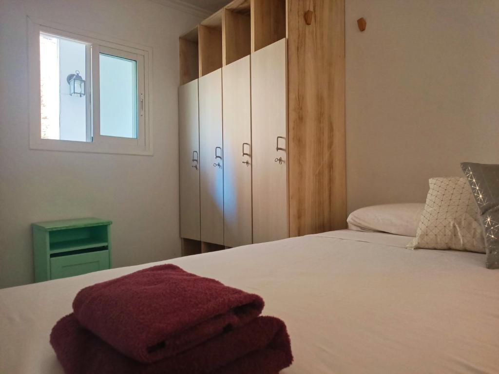 A bed or beds in a room at The Light appartment Tarragona