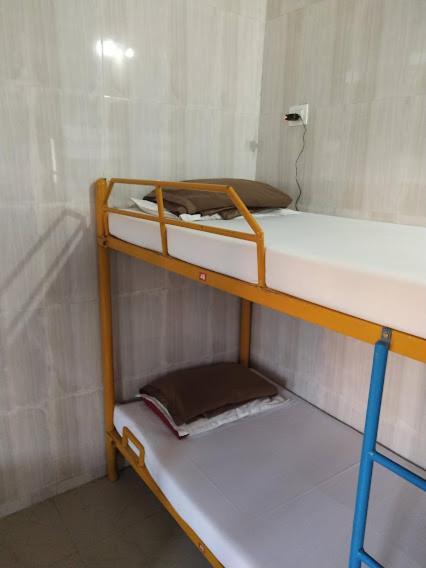 Postel nebo postele na pokoji v ubytování vrs dormitary