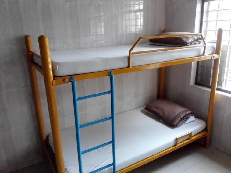 Postel nebo postele na pokoji v ubytování vrs dormitary