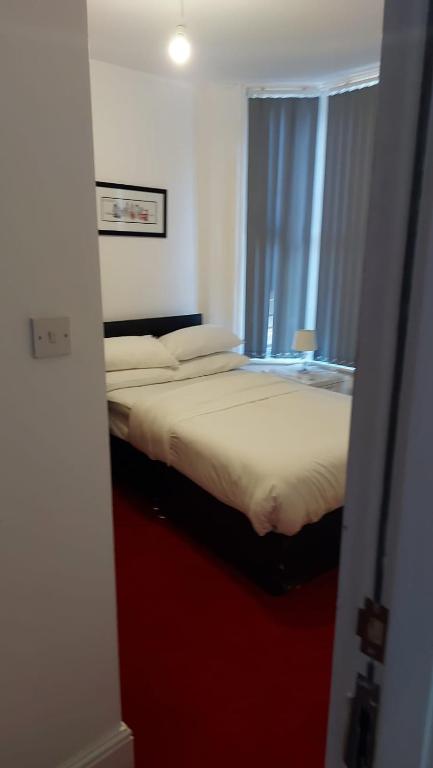 Postel nebo postele na pokoji v ubytování Midtown GuestHouse