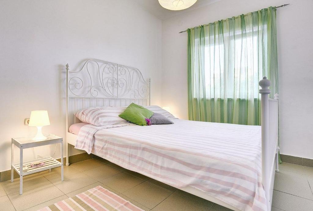 Katil atau katil-katil dalam bilik di Apartments Lidija