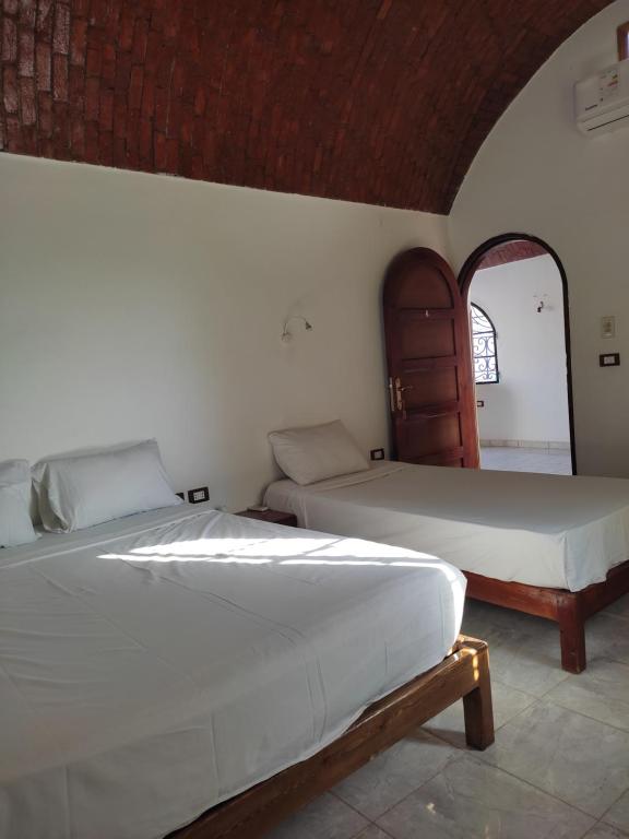 Postel nebo postele na pokoji v ubytování Nubian Holiday House Aswan