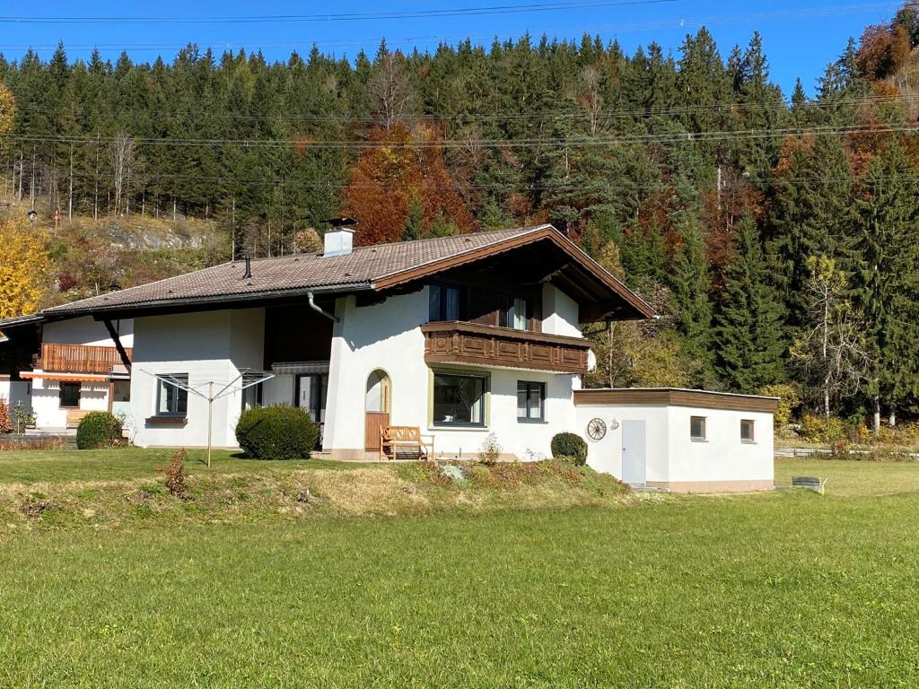 a house in a field with a green field at Erholung gesucht - gefunden in Pinswang