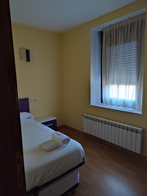 Postel nebo postele na pokoji v ubytování Albergue rural l'Almada de Yebra