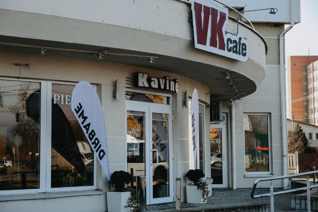 a store with a surfboard in the front of it at Verslo Klasė-easy to stay in Panevėžys