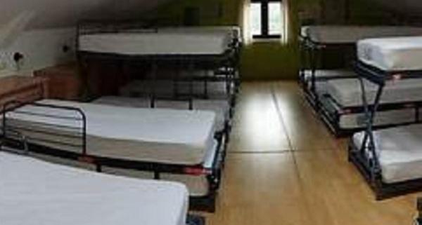 Postel nebo postele na pokoji v ubytování Albergue rural l'Almada de Yebra