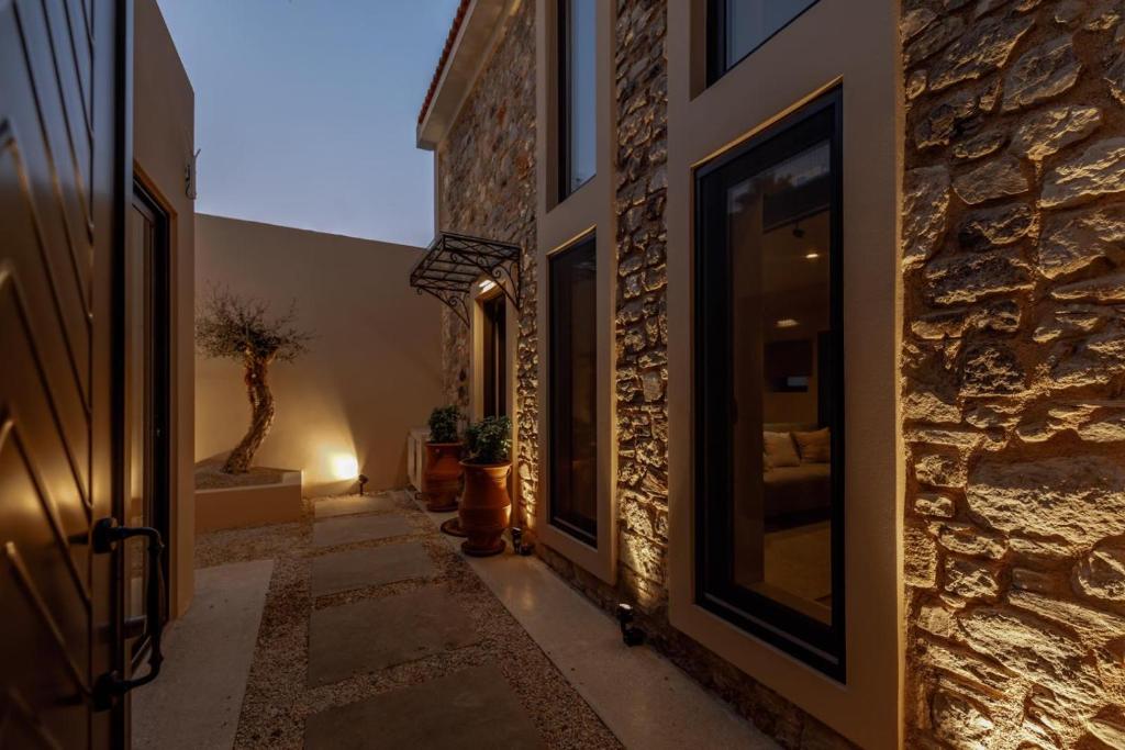 a hallway of a house with a stone wall at Spitaki by the sea in Kos Town